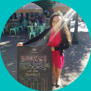 Francesca standing in front of a Books! Books! Books! sign outside.