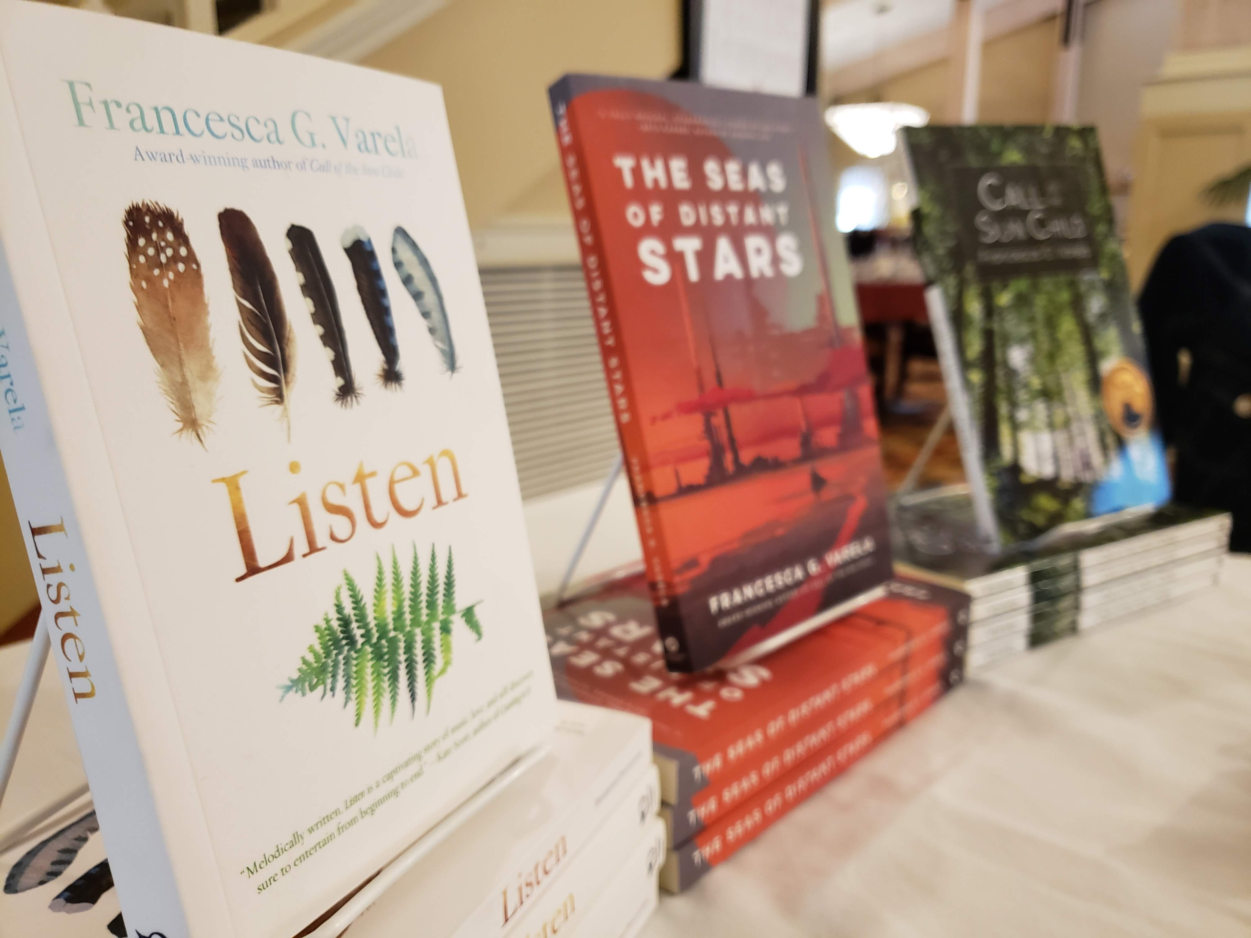 Row of Francesca Varela's books on a table