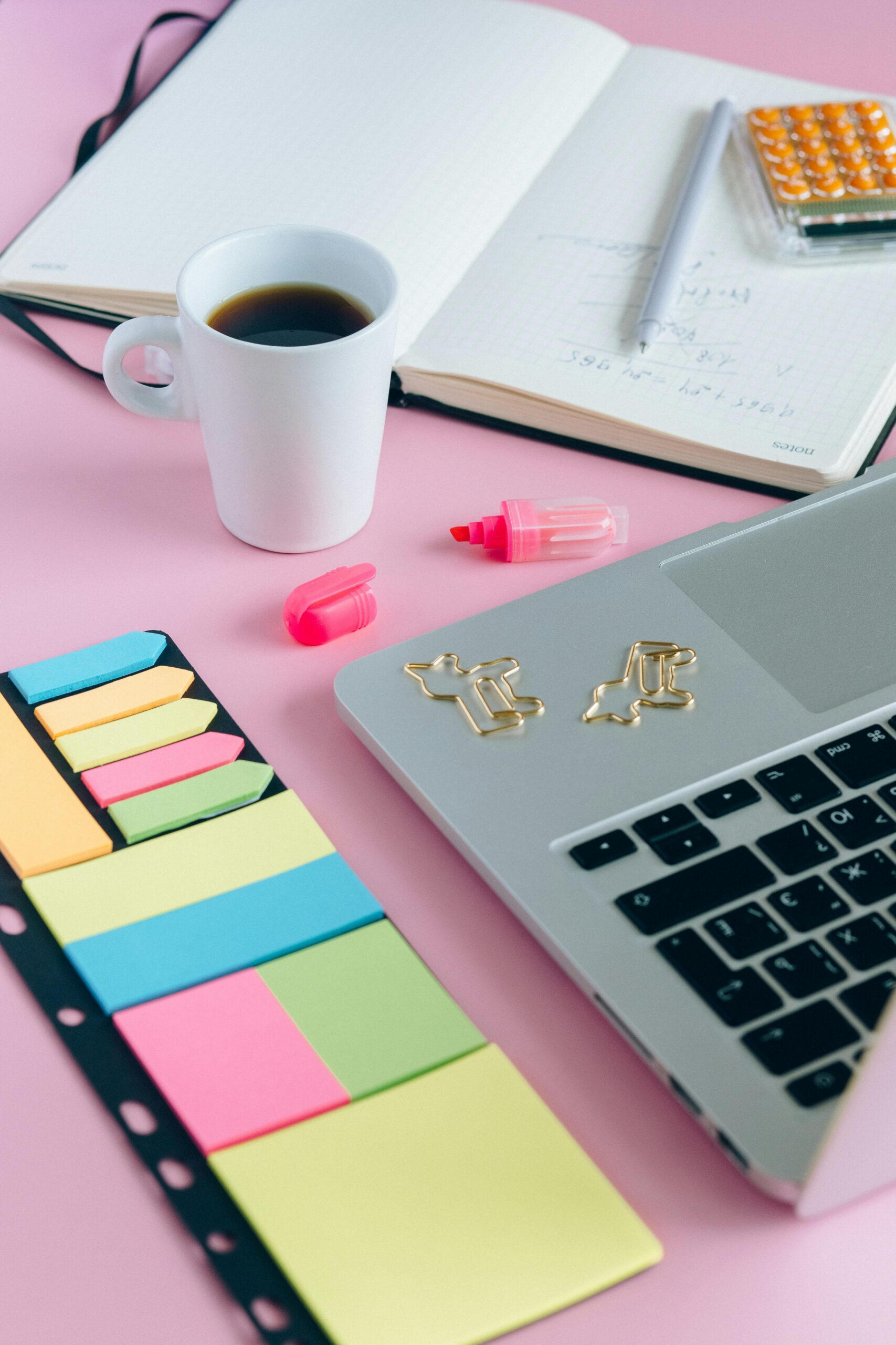 Pink desk Francesca Varela uses for copy editing for romance, science fiction, and fantasy authors 